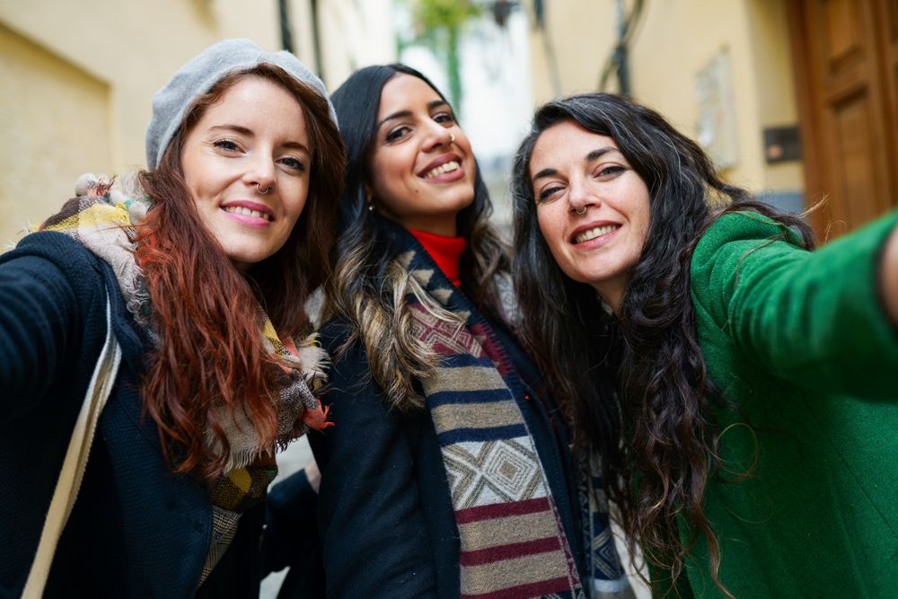 POV of women taking selfie from phone