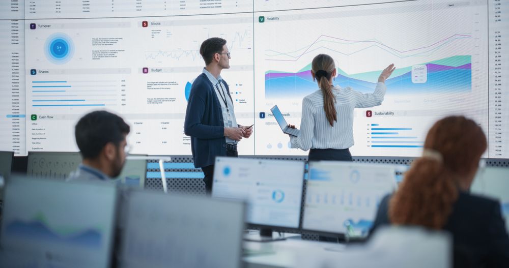 Diverse Employees Working Behind Computers in Artificial Intelligence Company.