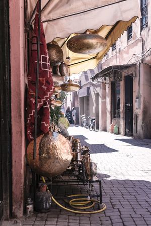 Copperware outside shop on street