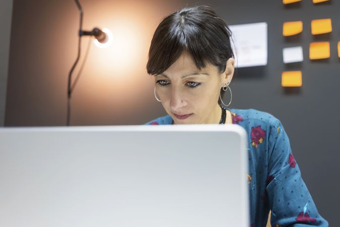 Smiling businesswoman working with laptop