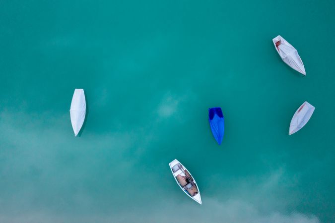 Drone image with fishing boats on Sylvenstein Lake, in Upper Bavaria, Germany