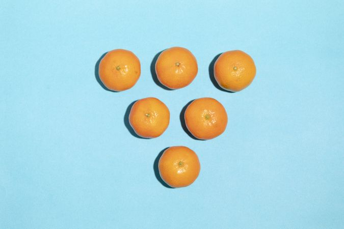 Juicy and natural tangerines forming a triangle shape