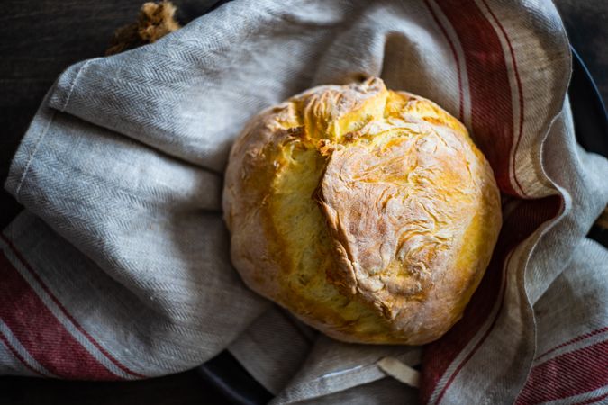 Freshly baked bread on a towel