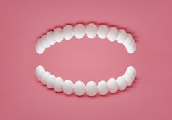 Human denture concept with chicken eggs
