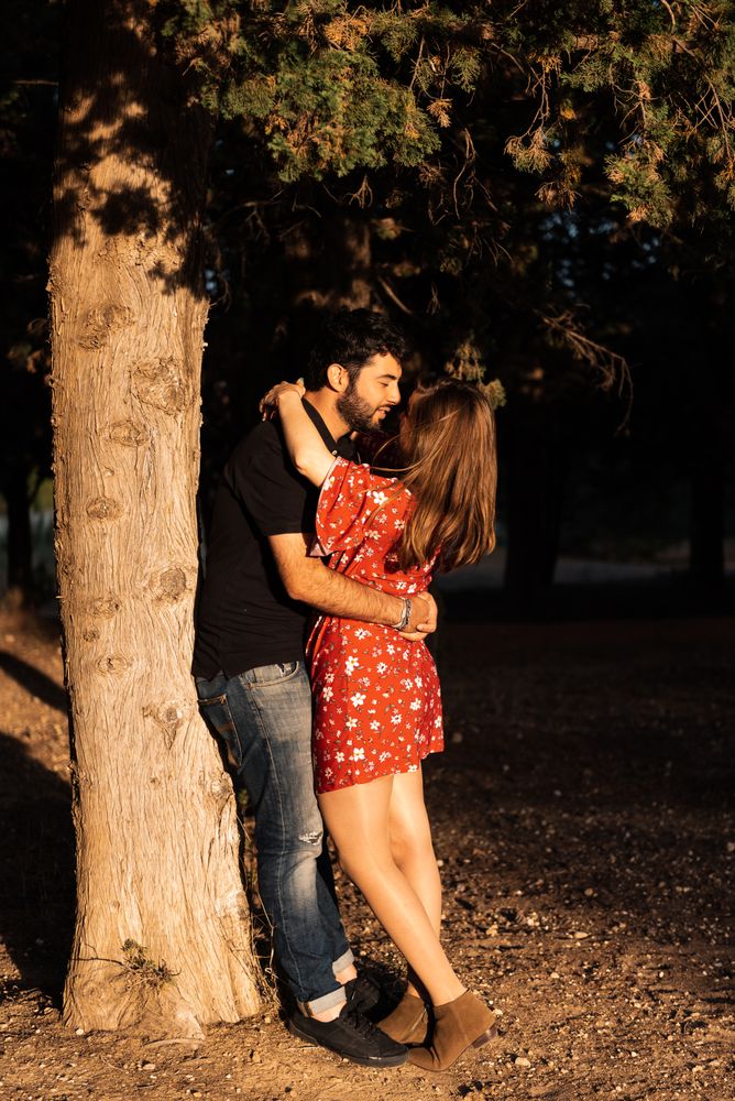 Young happy couple embracing in beautiful garden