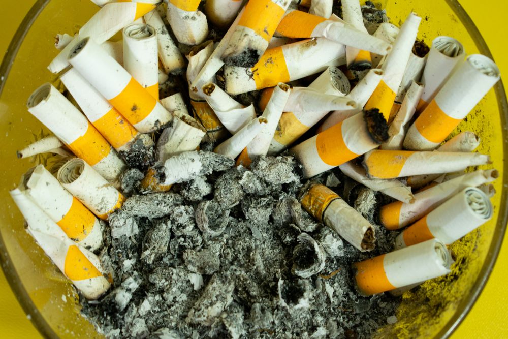 Top view of smoked cigarette in ash tray