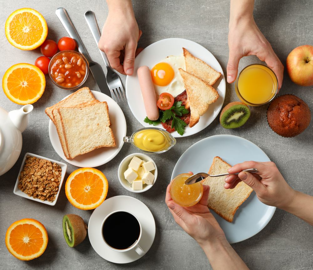 Top view square of two people eating breakfast
