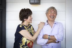 Smiling Chinese Couple Enjoying Their House