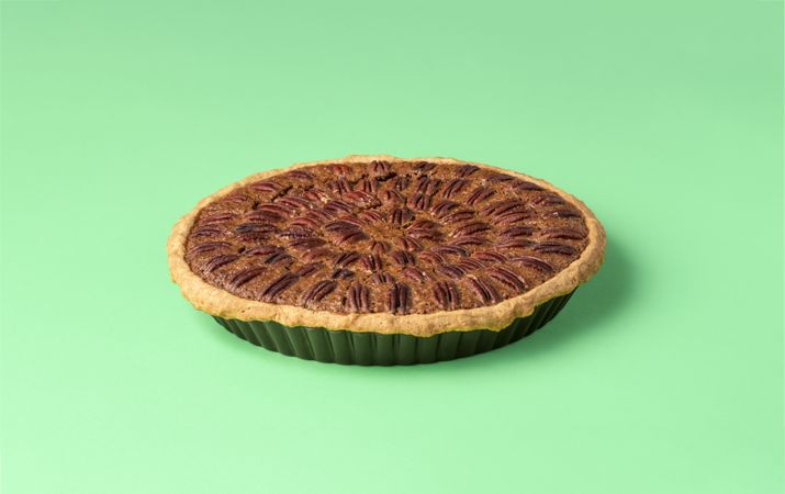 Pecan pie on a green table