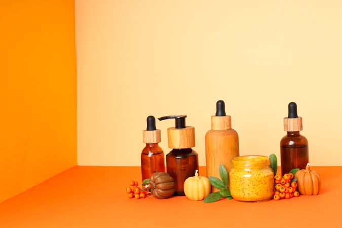 Skin care and face care concept - pumpkin cosmetic