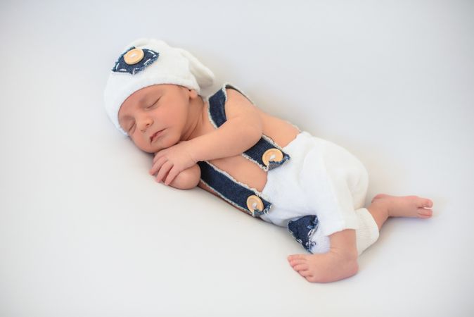 Cute infant sleeping on bed