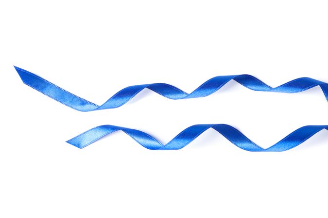 Blue ribbons isolated on plain background. Gift concept