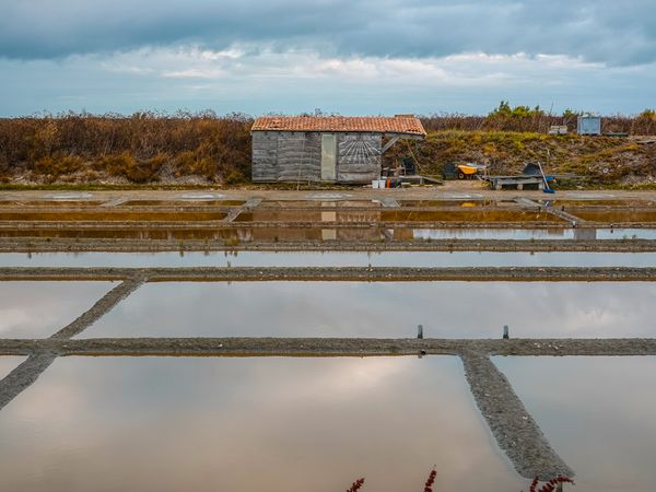 Farmer's shack with sundial next to the salt pans