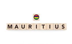 Wooden blocks bearing the name and flag of Mauritius. Mauritian and Indian Ocean Culture, national identity, travel, and geography in a copy space design.