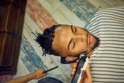 Anonymous hairstylist doing a haircut