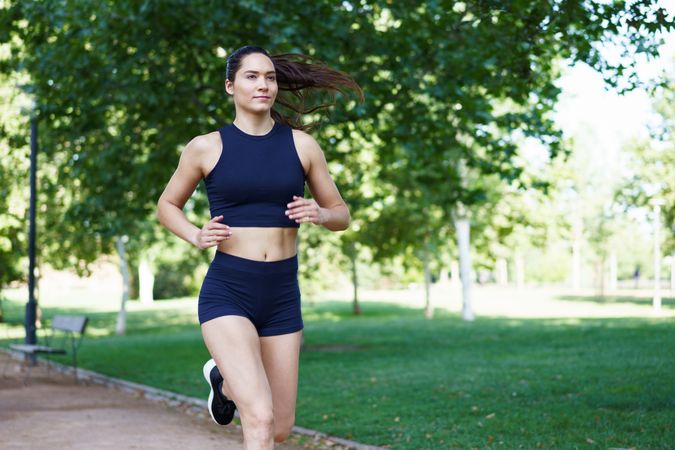 Fit woman jogging in park