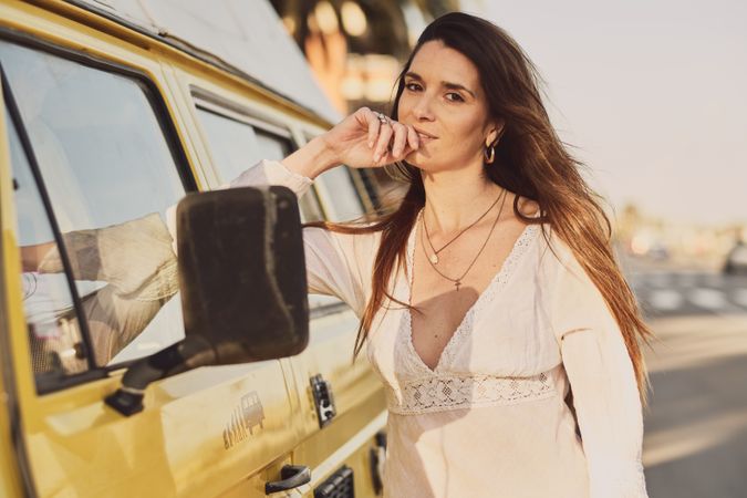 Young woman on a yellow van