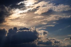 Grey and light clouds in the blue evening sky
