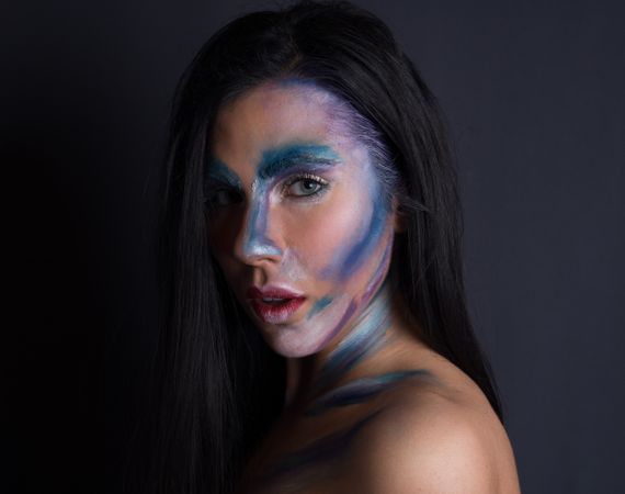 Young woman with painting face