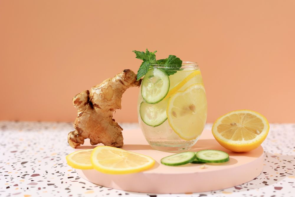 Infused iced water with lemon, ginger and cucumber garnish