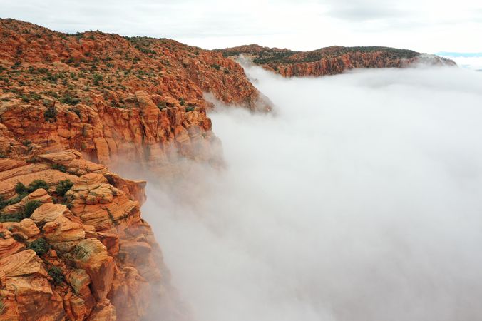 Brown rocky mountain with fog