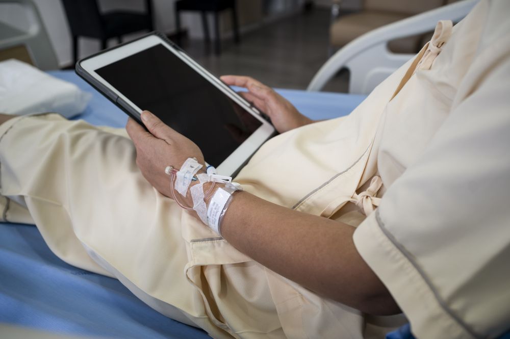Asian female patient recovering from illness in hospital room, health care concept.