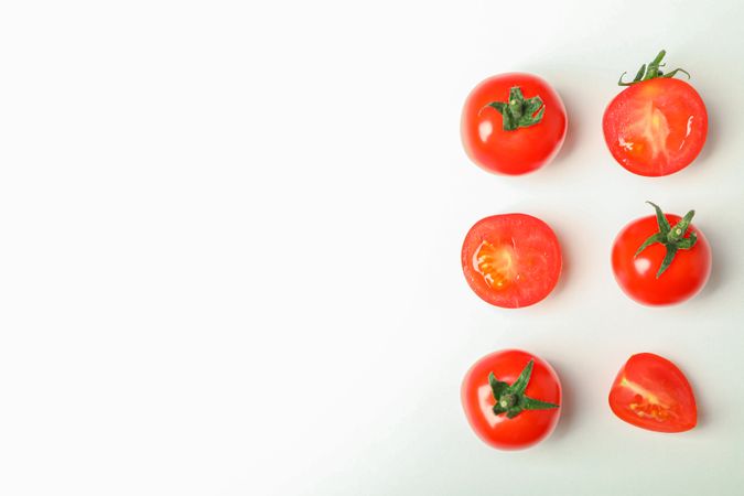 Flat lay composition with fresh cherry tomatoes on blank background, space for text. Ripe vegetables