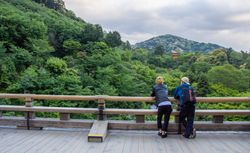 Japan - May, 10 2013: Anonymous persons looking at river and town