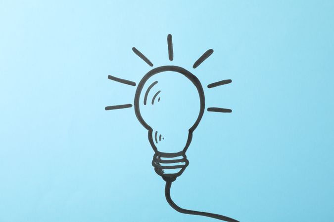 Drawn light bulb on blue background. Good idea concept