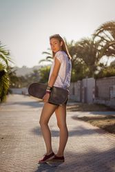Young girl with a skateboard outdoor