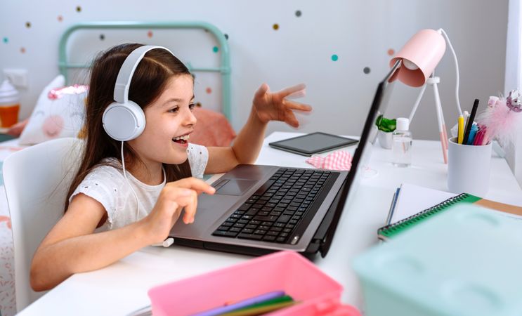 Girl studying from home with laptop