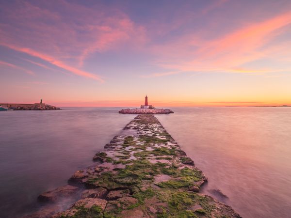 Rough path to islet with lighthouse
