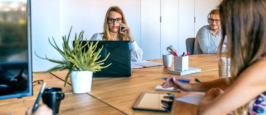 Woman working in the office surprised looking laptop