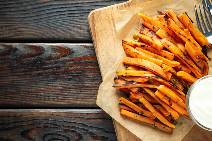 Concept of tasty food, fried sweet potato, space for text