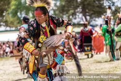 Red Wing, MN, USA - July 8th, 2017: Native American man dancing with feathers at Pow Wow bGPqA0