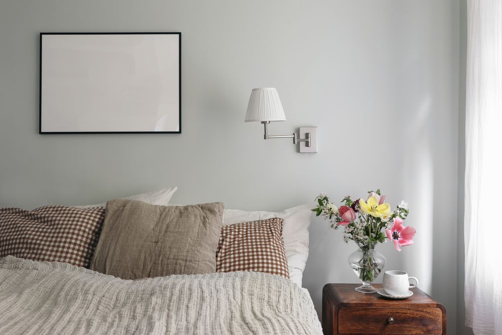 Elegant bedroom with tulips and cherry tree bouquet