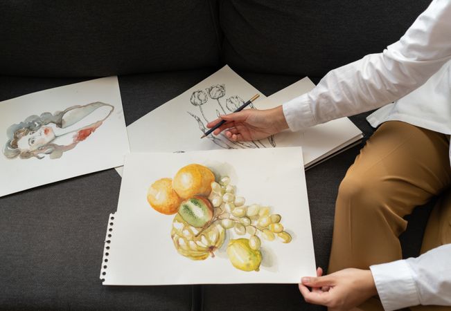 Woman with draws on papers