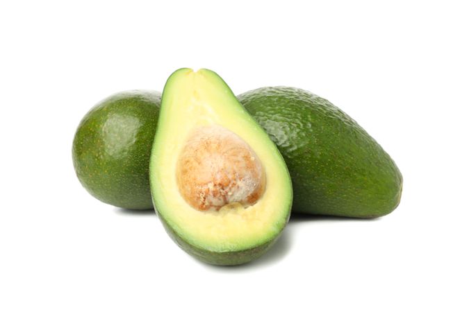 Ripe fresh avocado isolated on plain background