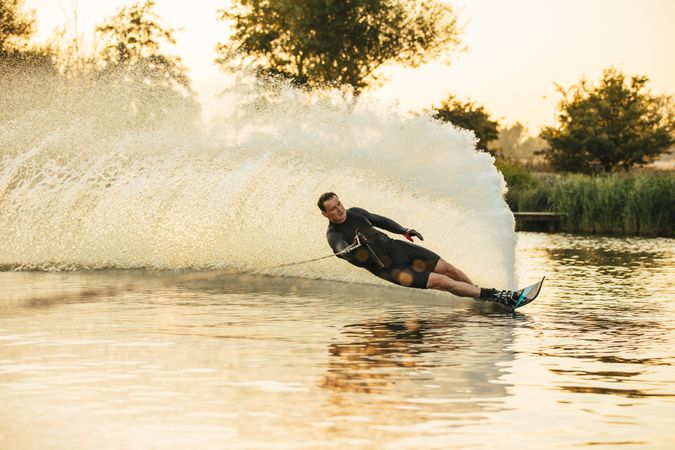 Man showing off his water skiing skills on a lake