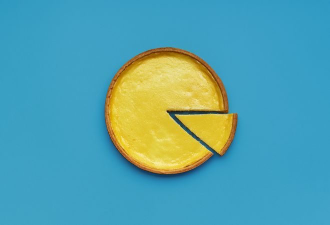Homemade cheese pie minimalist on a blue table