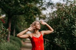 Dreamy young woman in summer garden