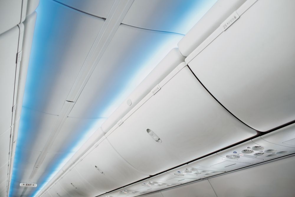 aircraft ceiling compartment with different buttons