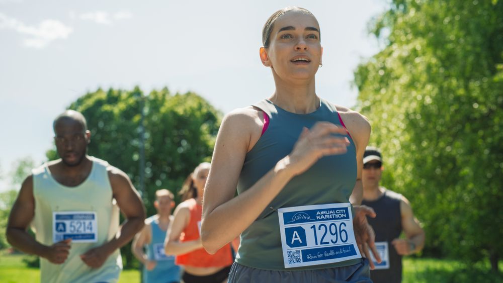 Portrait of a Woman Running and Participating in a Marathon in a Park.
