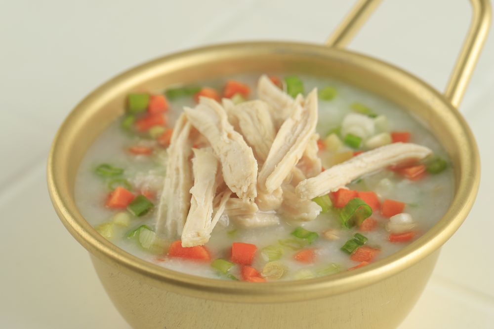 Dakjuk. Korean Chicken Rice  Porridge with Spring Onions and Diced Carrots