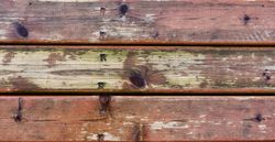 Outdoor deck wooden boards showing stress from outdoor weather