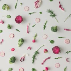 Colorful vegetable pattern made of broccoli, beetroot and radish