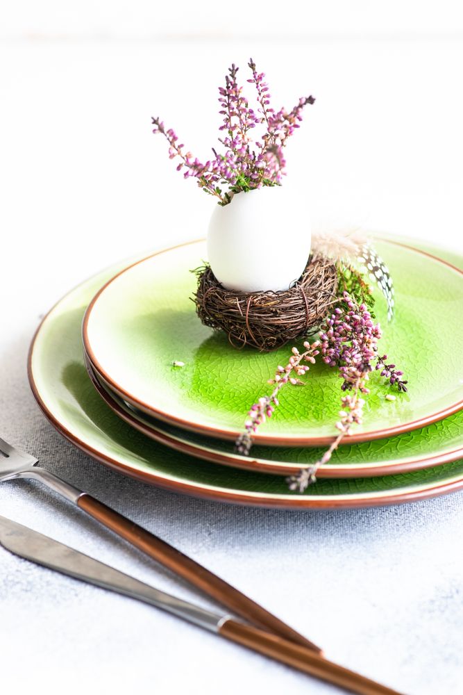 Heather in decorative egg on green plate for Easter dinner