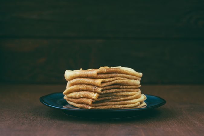 Sauce near stack of blini