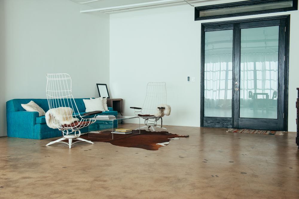 Bright open loft room with minimal furniture