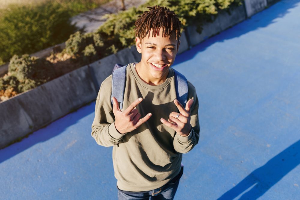 Young Black man showing shaka hand sign